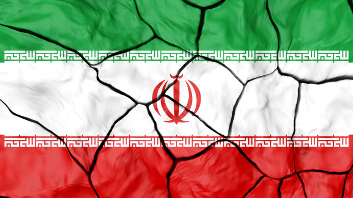 Iran Flag On Cracked background